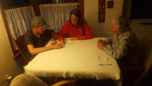 Dane, Maddy, Grandma Merlin playing Sheepshead